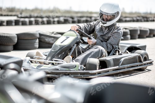 Preview: Man driving kart on the track