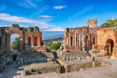 Preview: Ruins of ancient Greek theater in Taormina and Etna volcano in the background.
