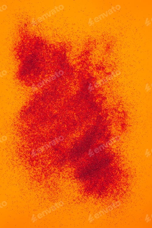 Preview: top view of scattered red sand on orange surface