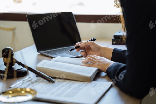 Preview: lawyer student is sitting at the reading table.