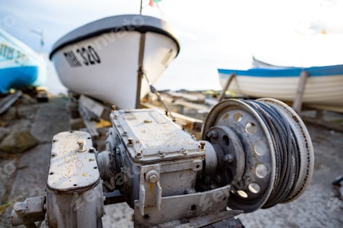 Preview: Winch with a rope on a pier with boats and boats against the sky