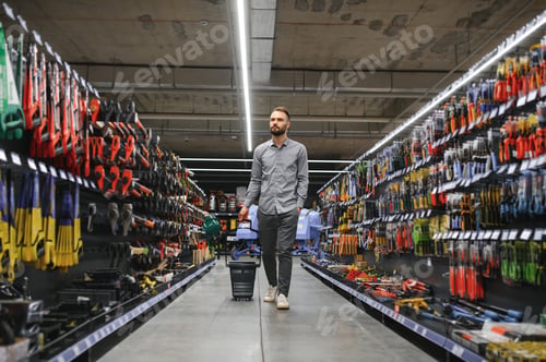 Preview: male builder in a hardware store