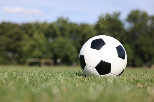 Preview: Soccer ball on green grass outdoors, space for text. Football game