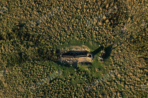 Preview: Aerial view of countryside shadoof well in meadow pasture
