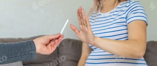 Preview: The pregnant woman refuses to smoke. Selective focus.