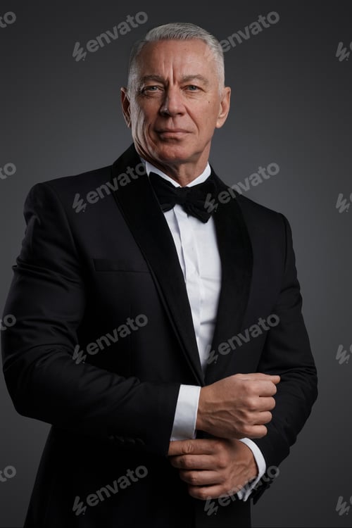 Preview: The distinguished old man stands confidently in a black suit