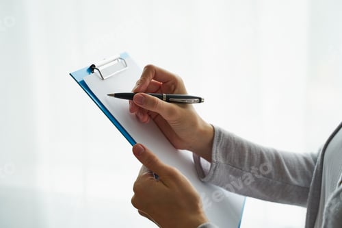 Preview: Unrecognizable person writing on clipboard, copy space