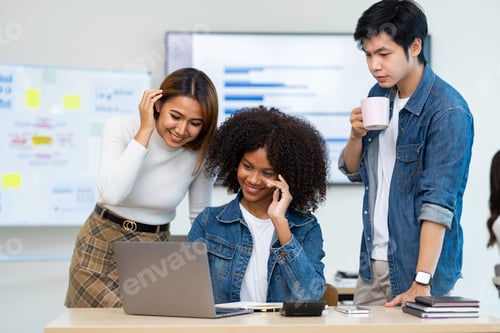 Preview: Business people working and brainstorming in office