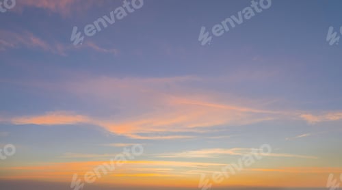 Preview: Sunset sky. Abstract nature background. Dramatic blue and orange, colorful clouds at twilight time.