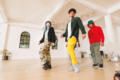 Preview: Image of group of group of diverse female and male hip hop dancers practicing in dance studio