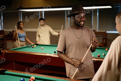 Preview: Black Man Chatting with Friend in Pool Club