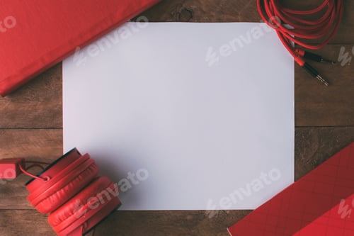 Preview: Invitation composed of red things with a wooden background.