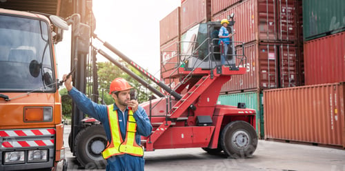 Preview: Engineer or foreman working and use talkie at container yard.