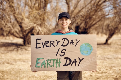 Preview: Happy teenage volunteer holding paperboard with 'every day is Earth Day' inscription.