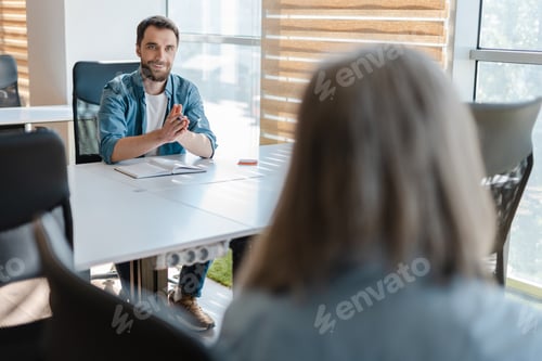 Preview: Colleagues working in modern office interior, discussing sales growth, planning business project