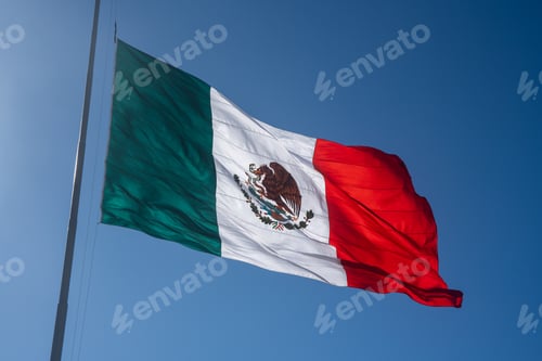 Preview: A low angle shot of the Mexican Flag waving on a sunny day in Mazatlan