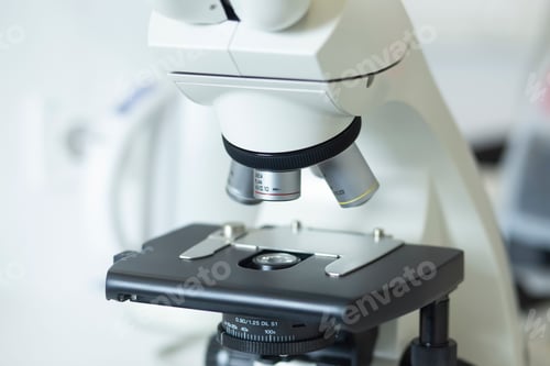 Preview: Closeup of a white microscope in a laboratory setting