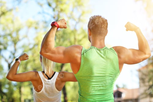 Preview: Young couple working out in park