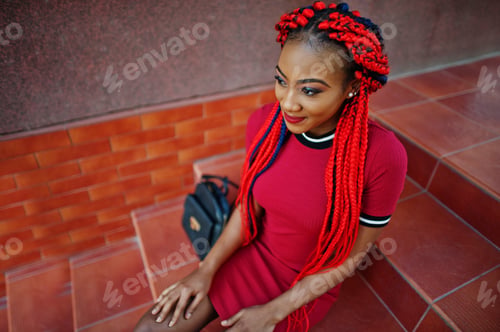 Preview: African american girl in red dress with dreadlocks