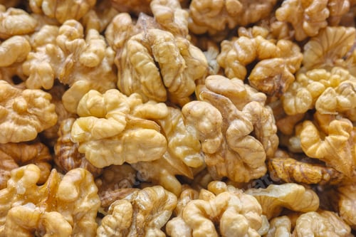 Preview: Close up photo of natural dried walnuts, selective focus, food background.