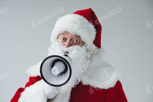 Preview: santa claus in eyeglasses holding megaphone and looking at camera