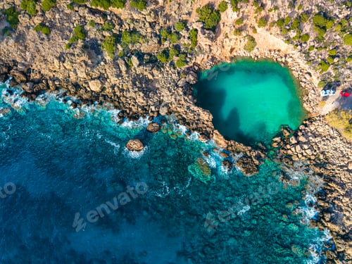 Preview: Aerial view of of a small sea crater surrounded by rocks, Voulolimni, Crete