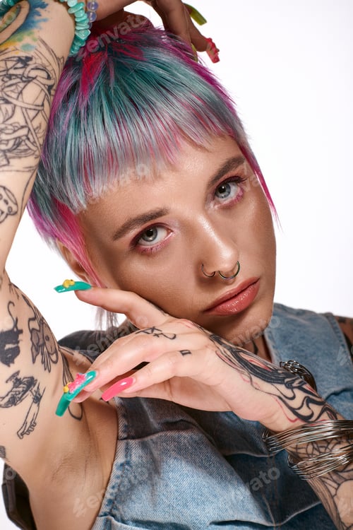 Preview: Colorful hair and bold tattoos highlight youthful spirit in vibrant studio setting