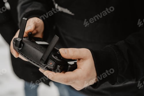 Preview: using technology/ drone / using mobile / technologies/ taking photo / controller
