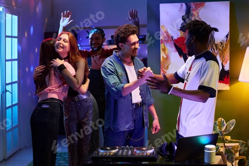 Preview: Group of young Multiethnic Friends Socializing and Celebrating at Party