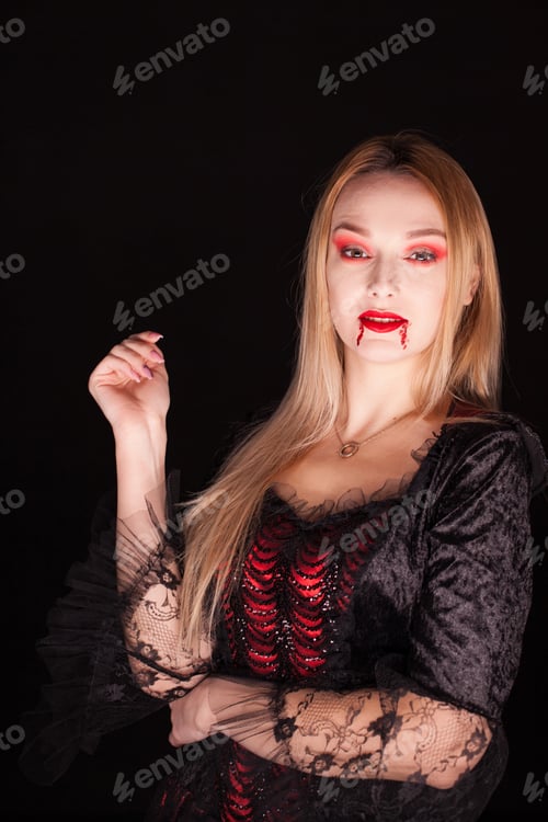 Preview: Woman with vampire red dress for halloween