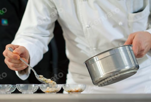Preview: Chef cooking in cups in a restaurant kitchen