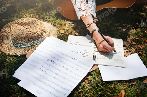 Preview: Woman writing down some lyrics