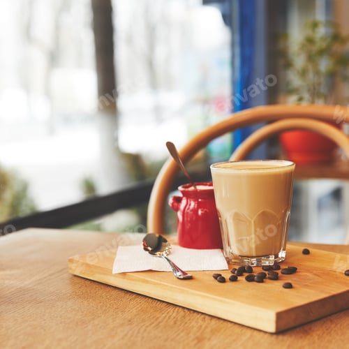 Preview: Hot flat white coffee in glass on table