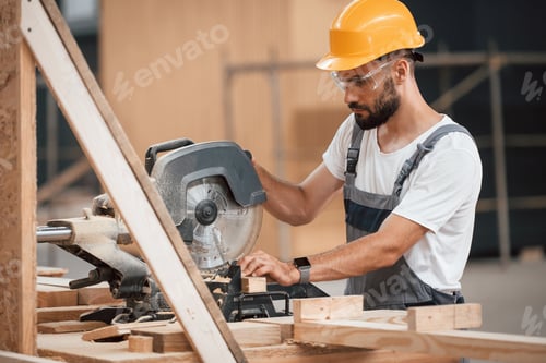Preview: Process of cutting the wood. Industrial worker in warehouse