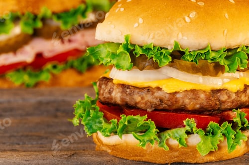 Preview: Closeup of home made burgers on wooden background cheeseburger cheese burger