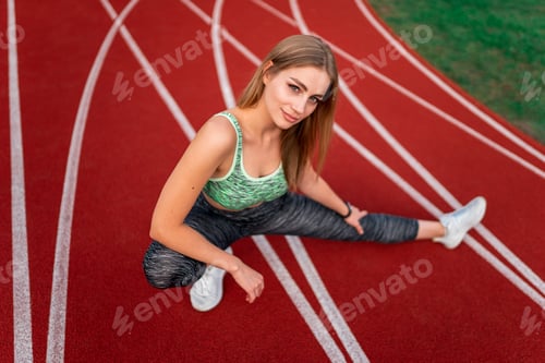 Preview: Pretty girl warms up before running