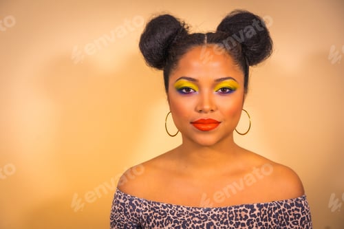 Preview: A sexy sensual woman with bright makeup and two side bun hairstyle posing in a studio