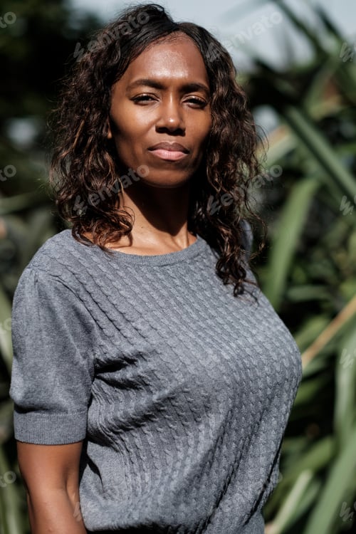 Preview: Portrait of mature black woman in a garden.