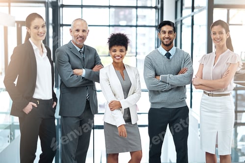 Preview: Portrait of a happy group of colleagues standing together in a modern office