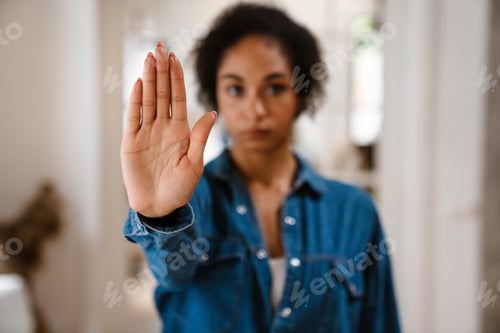Preview: Young black woman gesturing stop sign and protesting against abortion