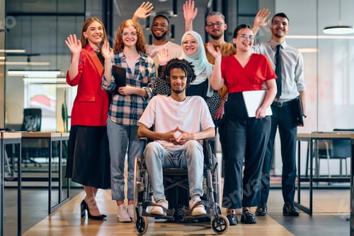 Preview: A diverse group of young business people walking a corridor in the glass-enclosed office of a modern