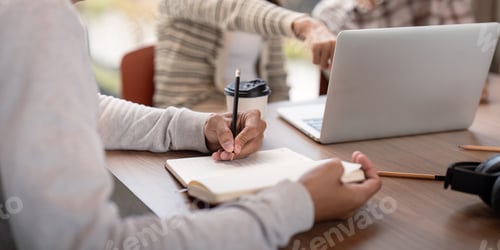 Preview: Focused Student Collaboration and Study Together with Laptops and Notebooks in a Modern Classroom