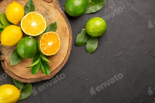 Preview: top view fresh lemons on the dark background lime sour fruit citrus