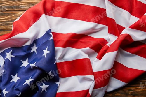 Preview: top view of traditional american flag on wooden surface