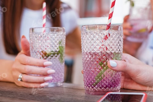 Preview: Drinking lavender cocktail in the bar