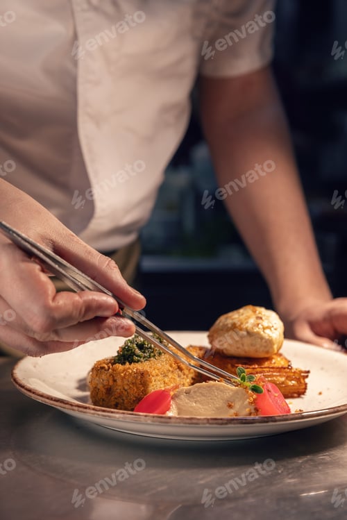 Preview: Professional chef adding finishing touches