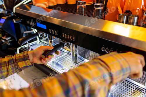 Preview: Professional barista young redhaired ginger bearded man in black apron working in coffee shop