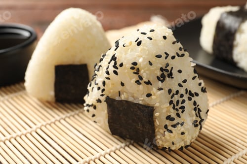 Preview: Rice balls (onigiri) on table, closeup. Traditional Japanese dish