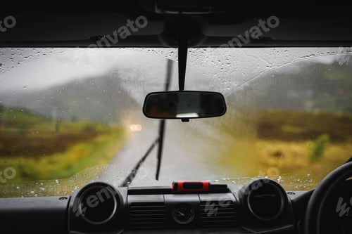 Preview: View of a rural road through the front glass