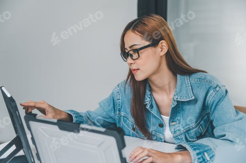 Preview: Woman Using Tablet Device in Bright Modern Office